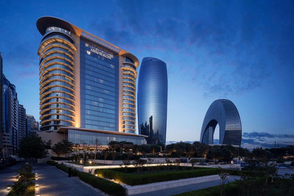 JW Marriott Absheron Baku tower illuminated at dusk