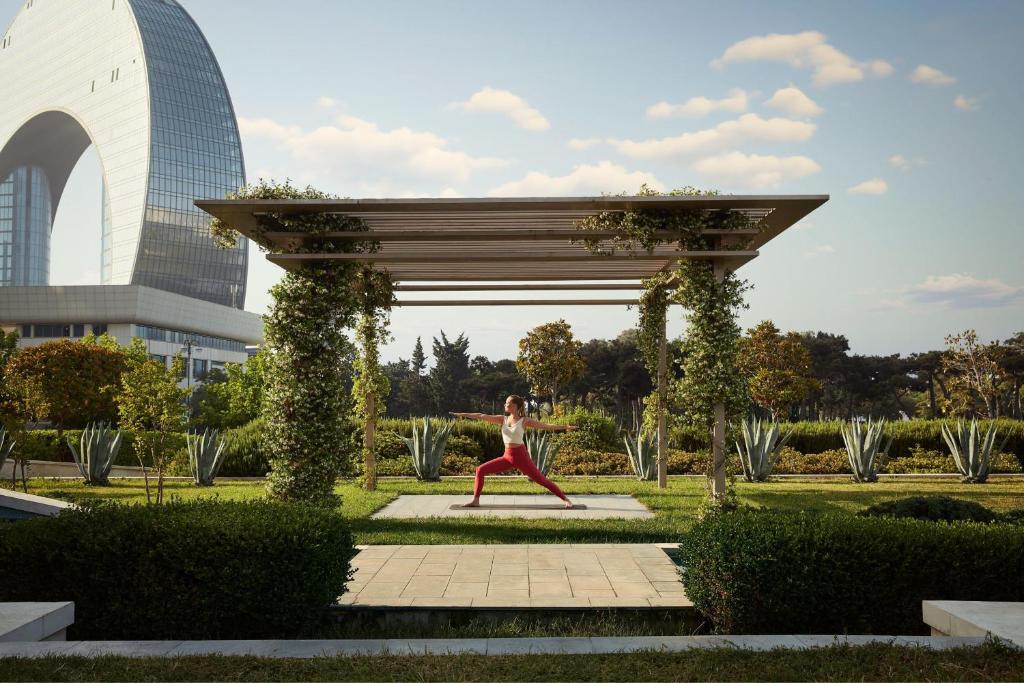 JW Marriott Absheron Baku garden with pergola and city view