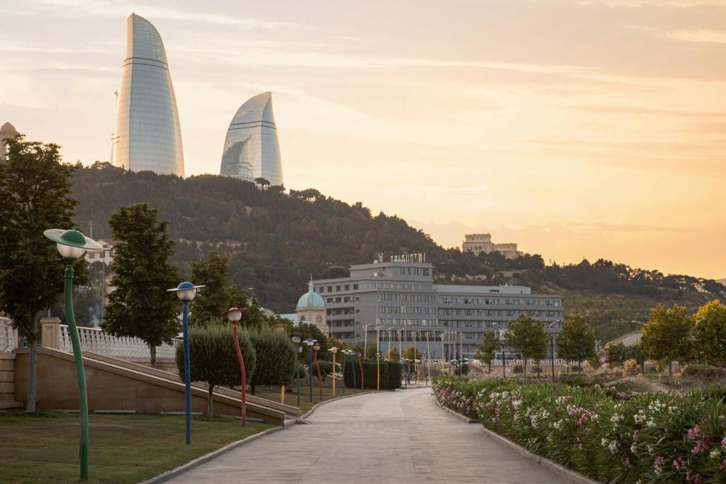 Sheraton Baku Intourist with Flame Towers in the background at sunset